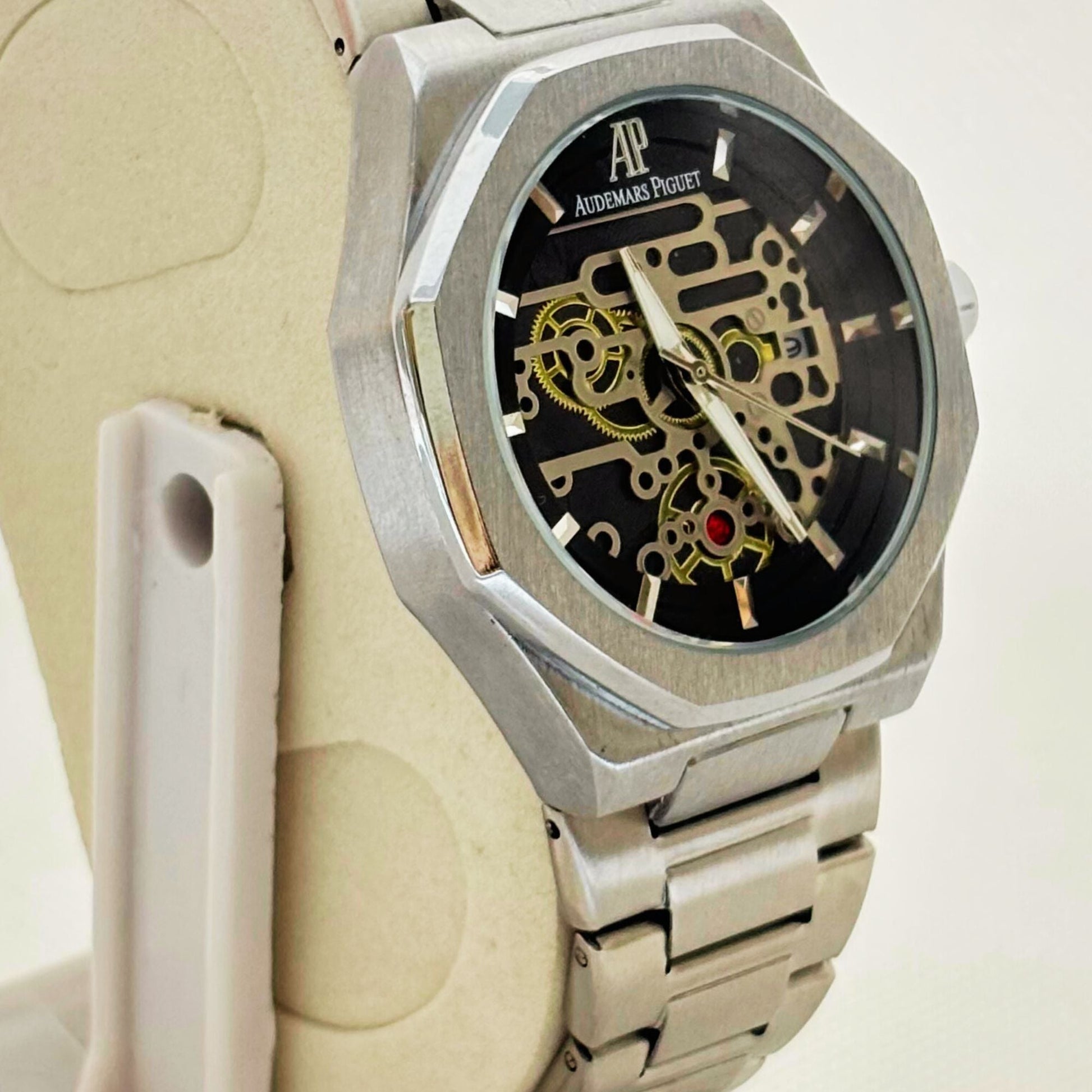 Stylish silver men's watch worn on wrist – modern and elegant accessory for formal and casual looks